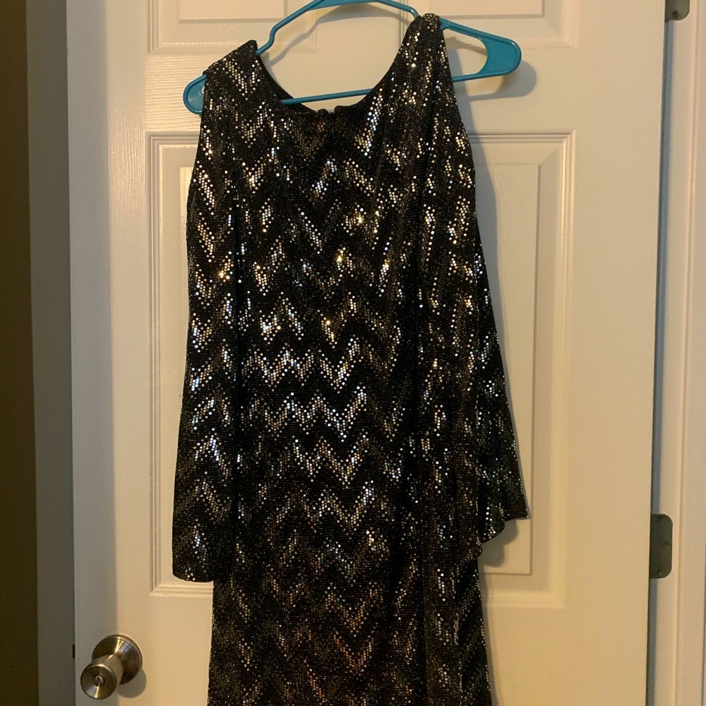 Black and silver, mid-length, long sleeve dress.